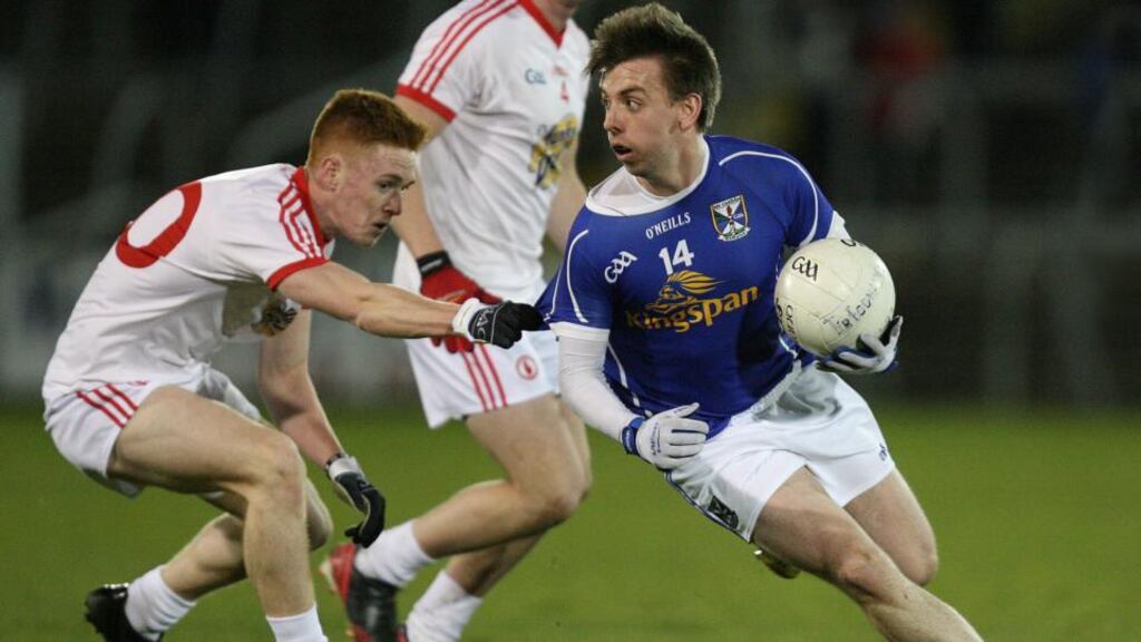 Cavan’s Kevin Bouchier is tackled by Tyrone’s Conor McAleer during their Ulster Under-21 quarter-final on Wednesday night. Photograph: Inpho