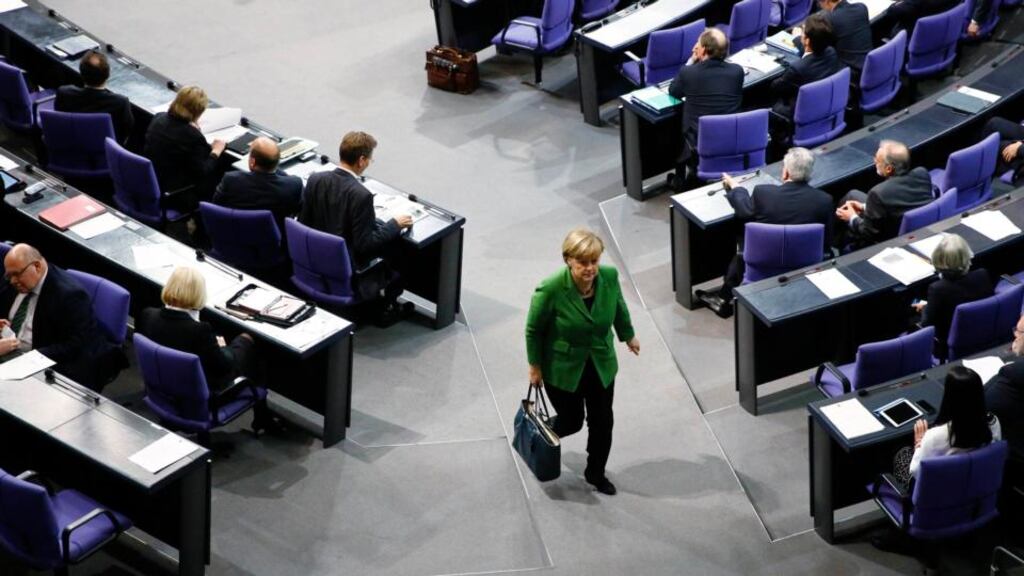 Chancellor Angela Merkel leaves a debate about the surveillance activities of the US National Security Agency. Photograph: Reuters/Thomas Peter