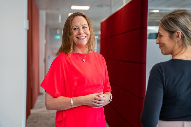 Kavanagh in conversation with colleagues at the company’s head office in Leopardstown
