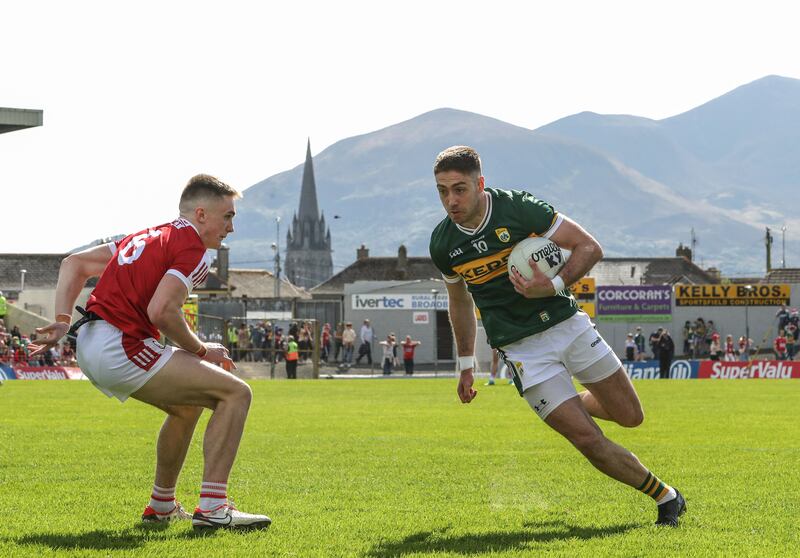 Kerry's Adrian Spillane takes on Cork's Tommy Walsh in the football championship semi-final at Fitzgerald Stadium, Killarney. Photograph: Bryan Keane/Inpho