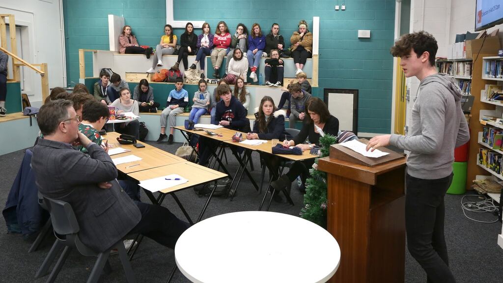Student Cian Gleeson addresses the house at a Coláiste Iognáid debate. Photograph: Joe O’Shaughnessy