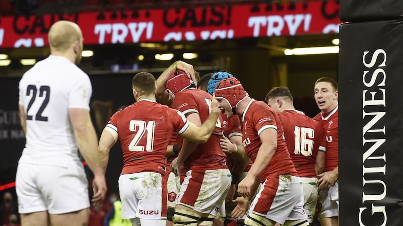 Cory Hill of Wales is congratulated by team-mates after scoring his team’s fourth try against England in Cardiff. The way they snatched 14 points through poor refereeing and Dan Biggar’s sneakiness will only make this Triple Crown taste sweeter. Photograph: Rebecca Naden/EPA