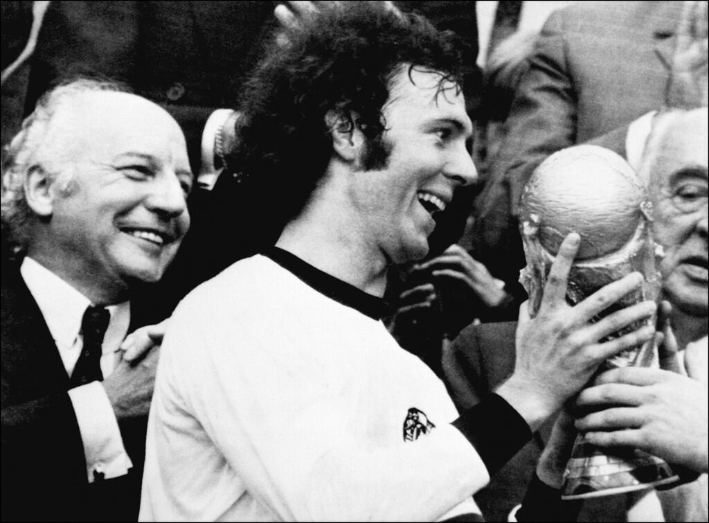 Germany captain Franz Beckenbauer receives the World Cup after defeating the Netherlands in 1974 at Munich's Olympic stadium. Photograph: STF/AFP via Getty Images