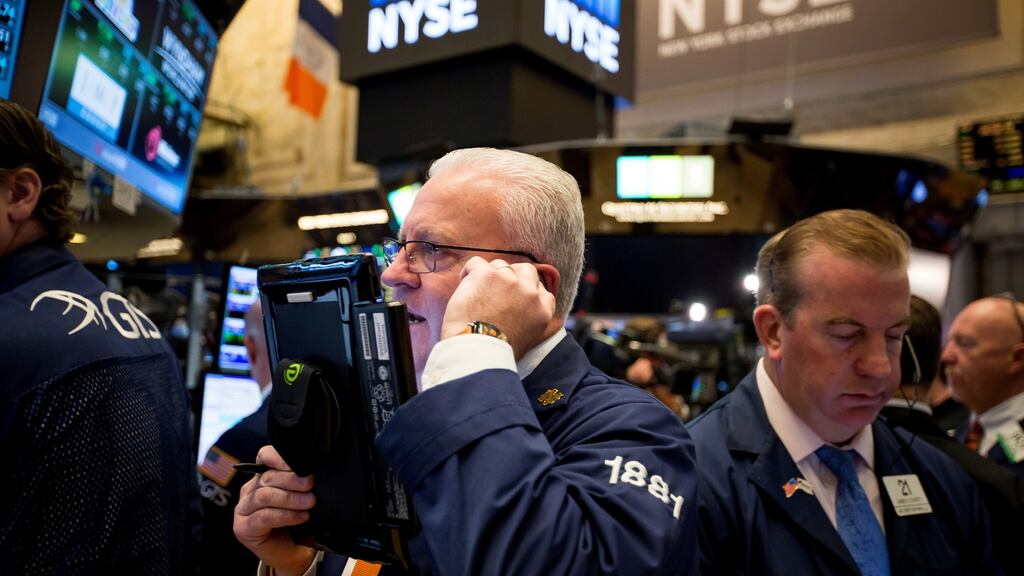 A trader works on the floor of the New York Stock Exchange: Wall Street stocks extended losses in early afternoon trading on Wednesday, with the S&P 500 headed for its seventh day of losses as a tightening race for the White House rattled investors. Photograph: Michael Nagle/Bloomberg
