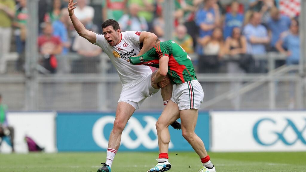 Seán Cavanagh gets in a tangle with Mayo’s Lee Keegan at Croke Park. There’s nothing new about the targeting of top players in the world of intercounty football. Photograph: Ryan Byrne/Inpho