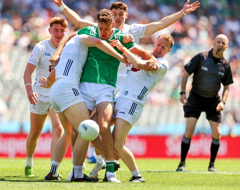 Limerick's Tommie Childs is tackled by Kildare’s Brendan Gibbons and Brian Byrne during the
Tailteann Cup Final at Croke Park. Photograph: Tom O’Hanlon/Inpho