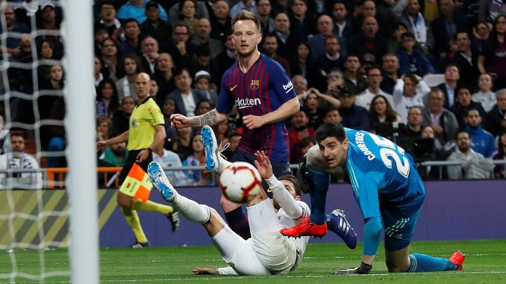 Barcelona’s Ivan Rakitic scores their first goal during the  La Liga games against  Real Madrid at the  Santiago Bernabeu stadium in Madrid. Photograph: Juan Medina/Reuters