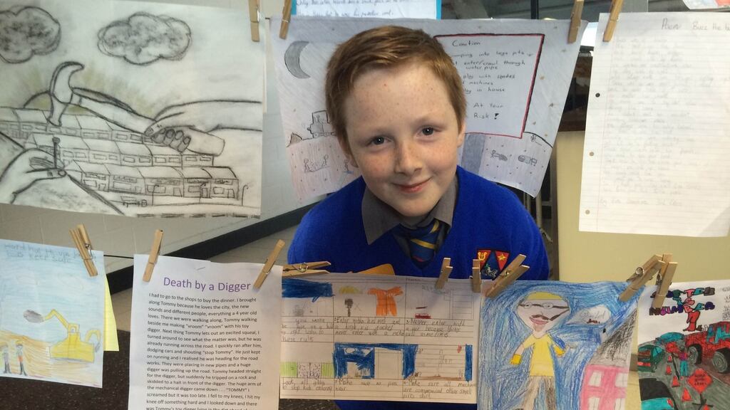 Carl Meehan, from Crumlin in Dublin, poses with his picture which is included in the Health and Safety Authority collection of children’s stories, poetry and drawings, Grandad Built My House. Photograph: Sorcha Pollak/The Irish Times