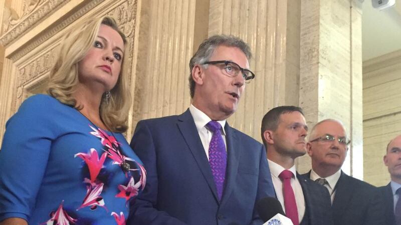 UUP leader Mike Nesbitt (centre): The formation of an official opposition “heralds a new era for devolved politics at Stormont, and a big, bold step forward to normal democracy for Northern Ireland”. Photograph: David Young/PA Wire