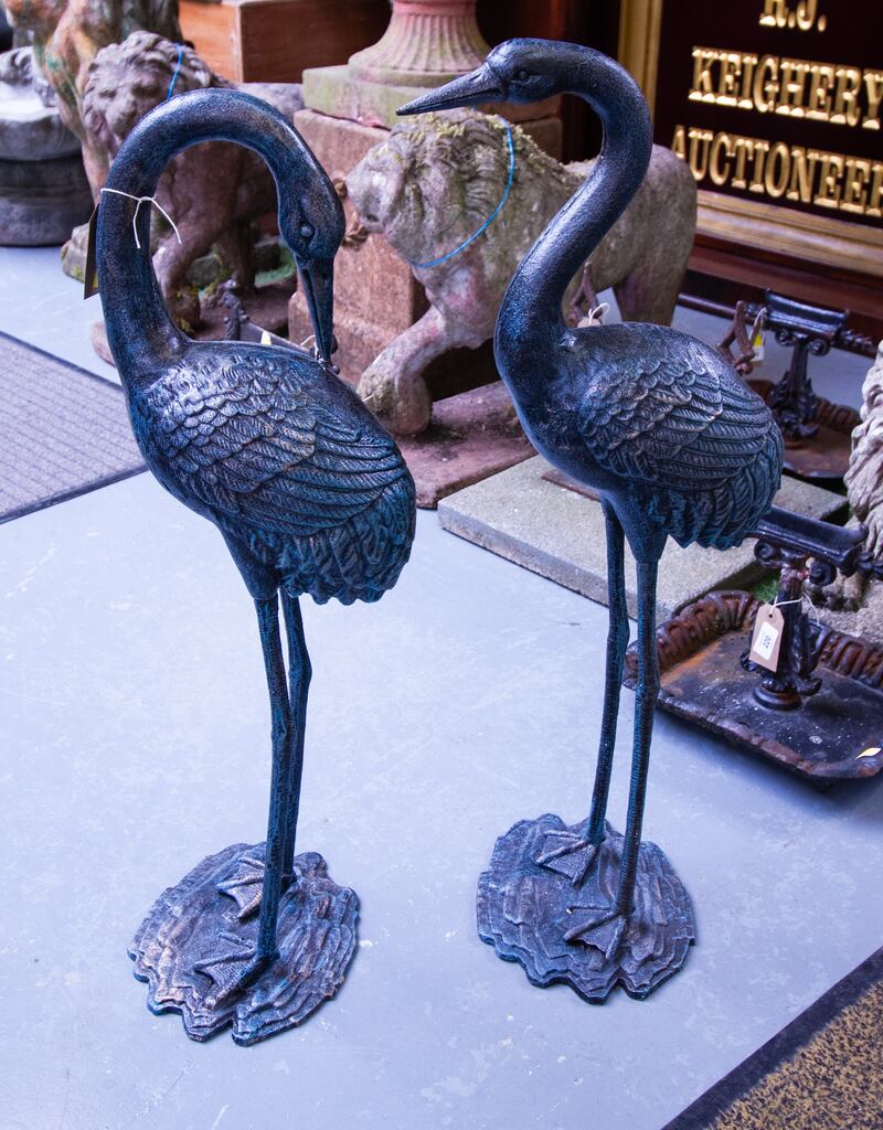 Pair of black painted cranes (€150-€250), Keighery's garden furniture auction