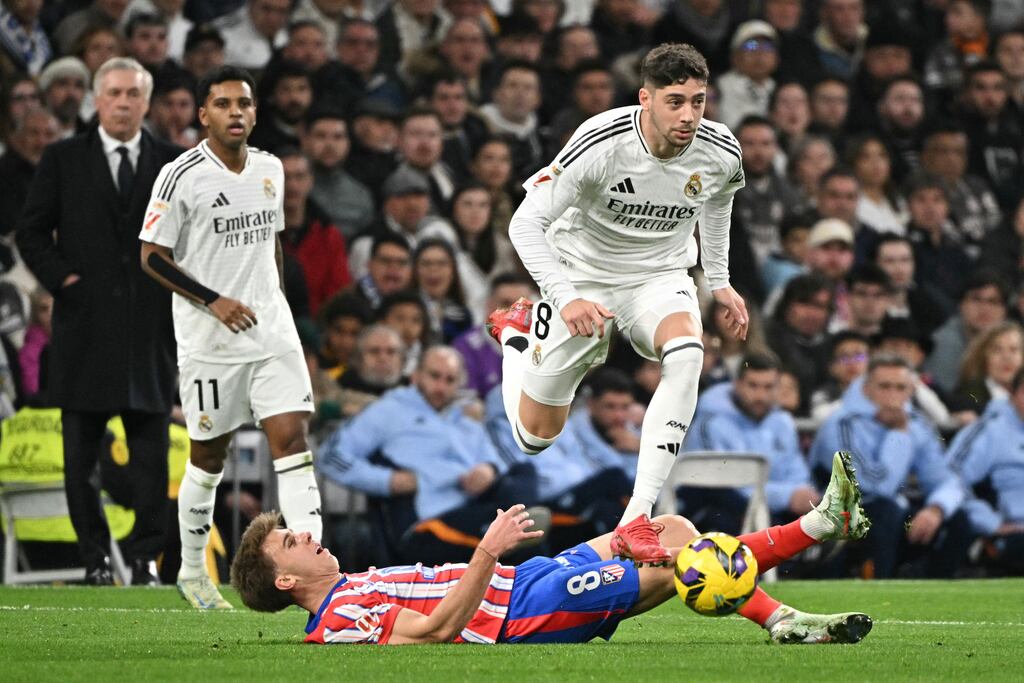 Real Madrid midfielder Federico Valverde jumping over Atletico Madrid midfielder Pablo Barrios during a Spanish league match at the Santiago Bernabeu stadium in Madrid on February 8th, 2025. Photograph: JAavier SOoriano/AFP