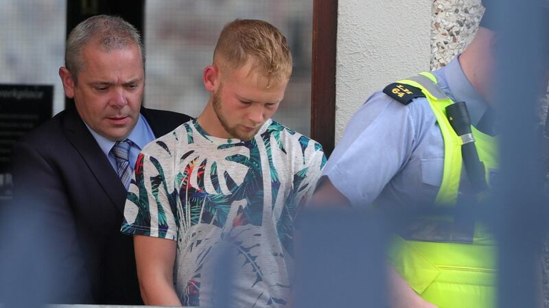 Aaron Connolly (18) (centre) pictured outside Drogheda District Court on Friday morning where he was charged with the murder of Cameron Reilly in Dunleer. Photograph: Colin Keegan/Collins