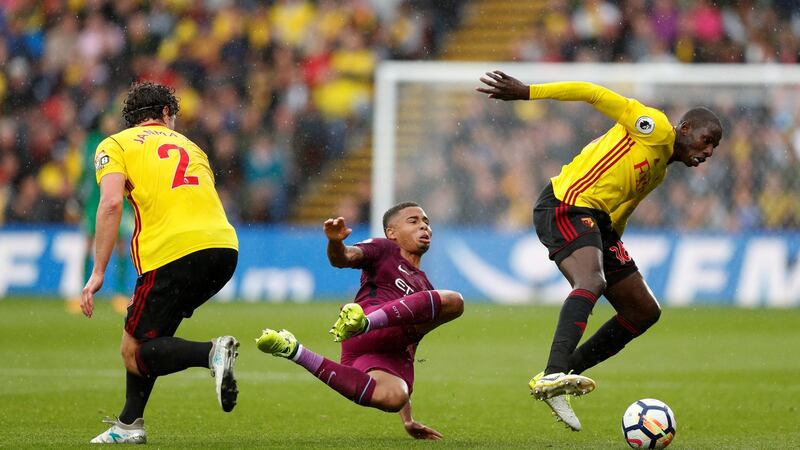 Watford’s Daryl Janmaat and Abdoulaye Doucoure in action with Manchester City’s Gabriel at Vicarage Road. Photograph: John Sibley/Reuters