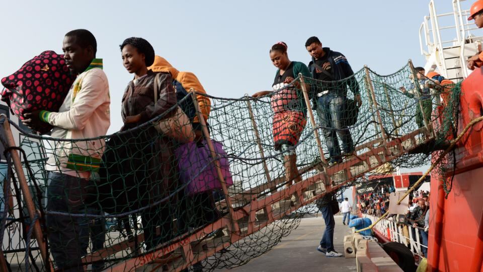 On solid ground: Migrants arriving at Porto Empedocle in Sicily after being rescued 40km off the Libyan coast by a Dutch freighter, the Dinteldijk. Photograph: Frank Miller