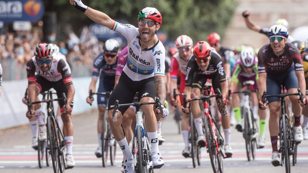 Giacomo Nizzolo of Team Qhubeka Assos celebrates after crossing the finish line to win the 13th stage of the 2021 Giro d’Italia. Photo: Luca Zennaro/EPA