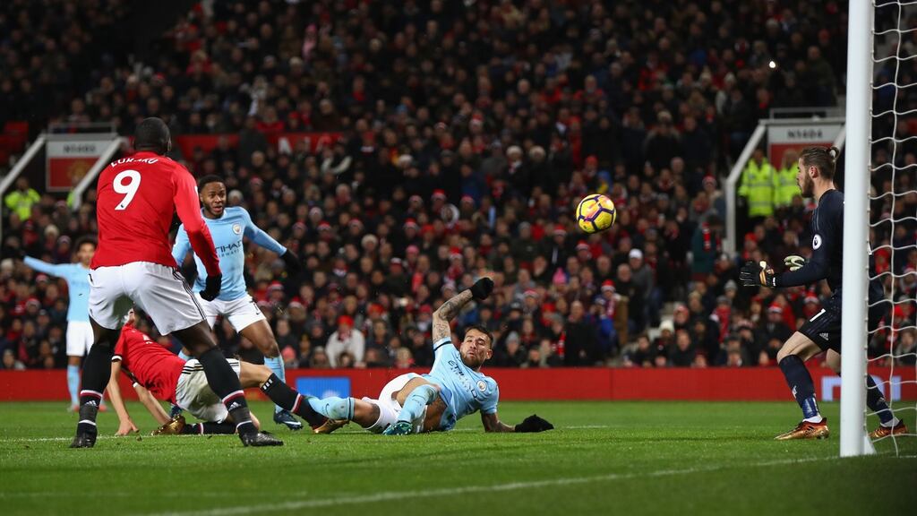 Nicolas Otamendi turns in Manchester City’s winner at Old Trafford. Photograph: Michael Steele/Getty