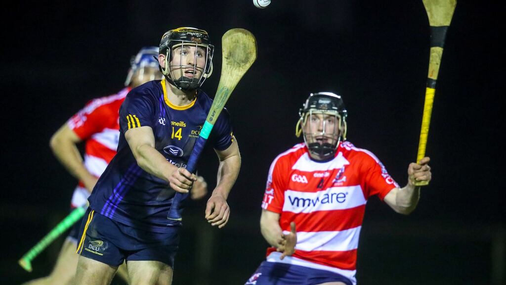 DCU’s James Bergin in action against with Kevin Galvin of CIT during the Fitzgibbon Cup clash at DCU Sportsgrounds. Photograph: Oisín Keniry/Inpho