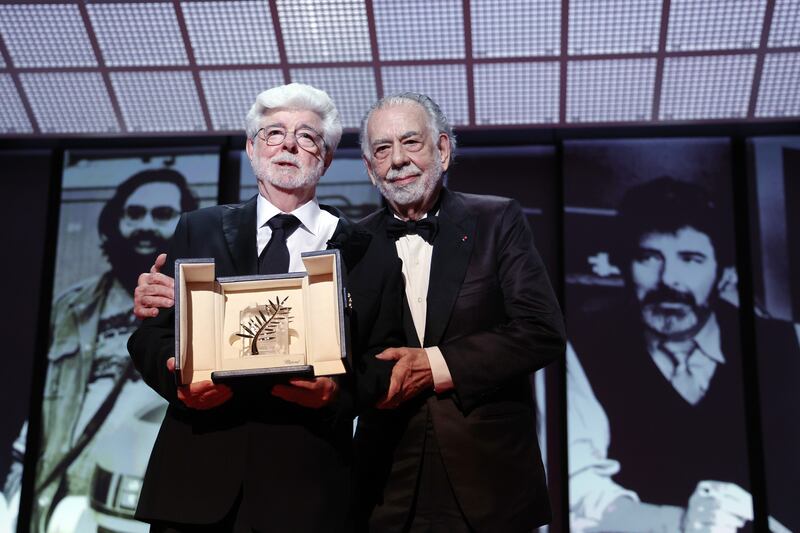 George Lucas (left) receives the Honorary Palme d’Or award from Francis Ford Coppola at Cannes on Saturday. Photograph: Pascal Le Segretain/Getty