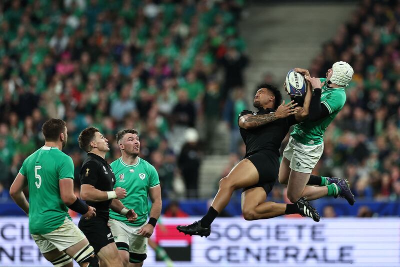 New Zealand's left wing Leicester Fainga'anuku and Ireland's right wing Mack Hansen jump for the ball during their quarter final match on Saturday. Photograph: AFP