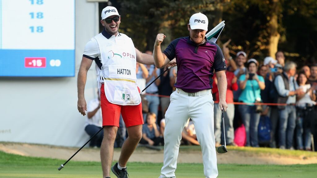 Tyrrell Hatton of England celebrates victory with his caddie during the final round of the 2017 Italian Open at Golf Club Milano - Parco Reale di Monza. Photo: Christopher Lee/Getty Images