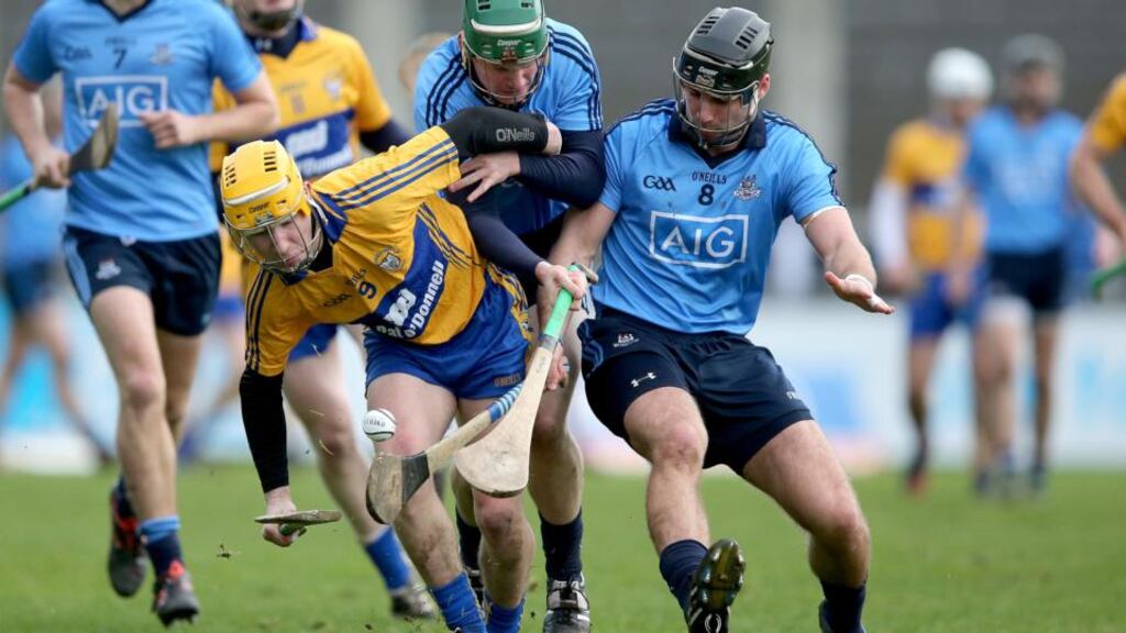 Dublin’s Simon Timlin and Shane Durkin tussle with Colm Galvin of Clare at Parnell Park. Photo: Dan Sheridan/Inpho