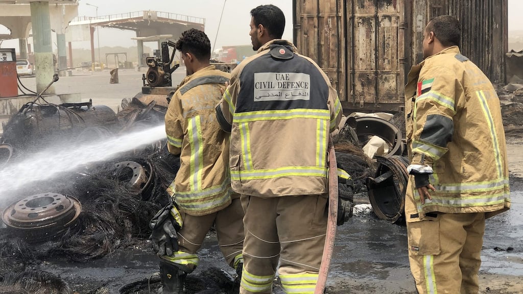 Firefighters extinguish a fire following clashes between pro-government forces and separatists in the Mansoura district of  Aden, Yemen on Sunday. Photograph: Nabil Hasan/AFP/Getty Images
