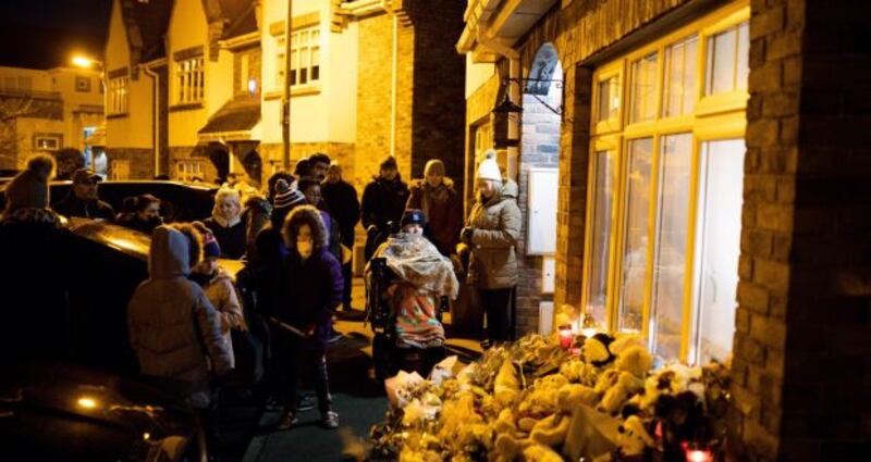 Vigil for Conor, Darragh and Carla McGinley on Wednesday night at their home in Parson’s Court, Newcastle, Co Dublin. Photograph: Tom Honan