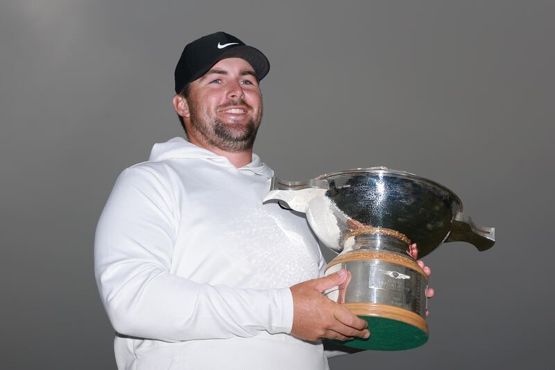 Chris Gotterup of the United States poses for a photograph with the Genesis Scottish Open. Photograph: Warren Little/Getty