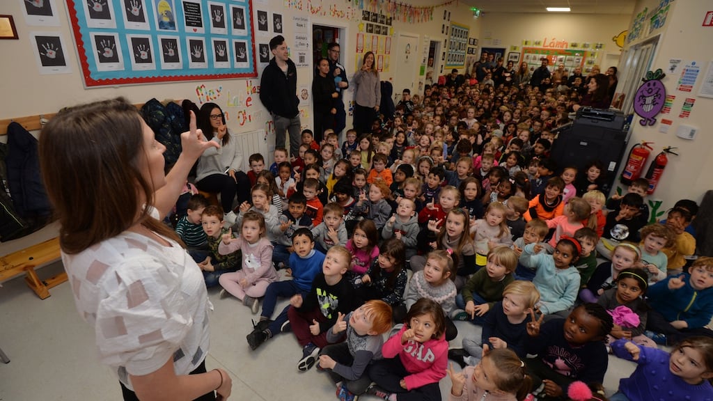 Caitríona Ní Cheallaigh, principal at Pelletstown Educate Together National School, addresses pupils in a corridor which doubles up as a PE space when the weather is wet. Photograph: Alan Betson/The Irish Times