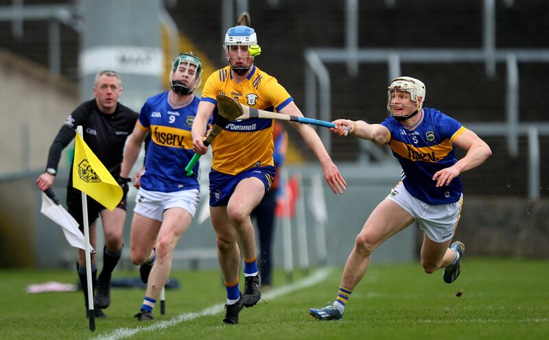 Clare’s Diarmuid Ryan evades Bryan O’Mara of Tipperary. Photograph: Ryan Byrne/Inpho