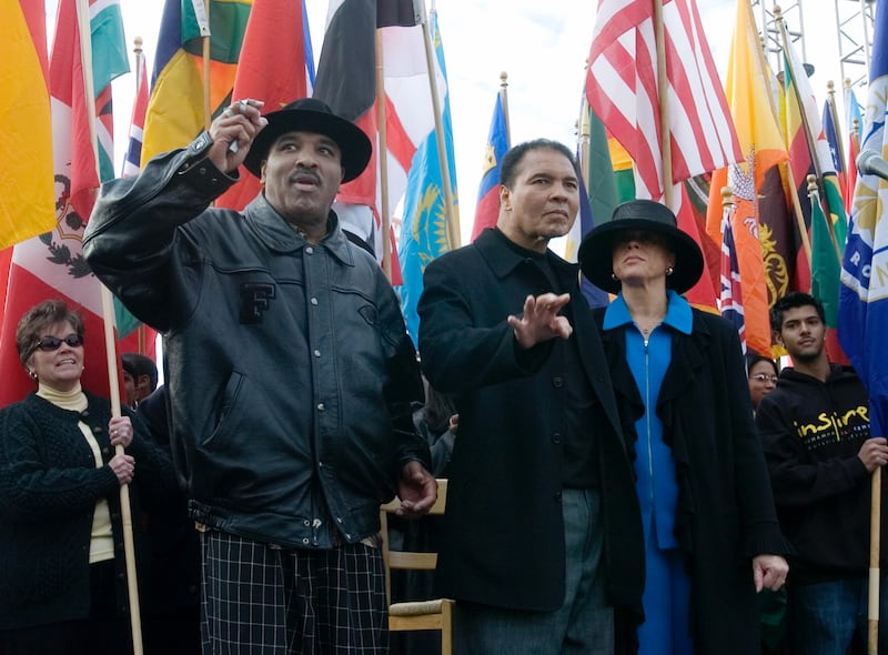 Muhammad Ali (centre) acknowledges the crowd with his brother Rahaman Ali and wife Lonnie Ali in Louisville, Kentucky, in 2005. Photograph: David R. Lutman/Getty Images