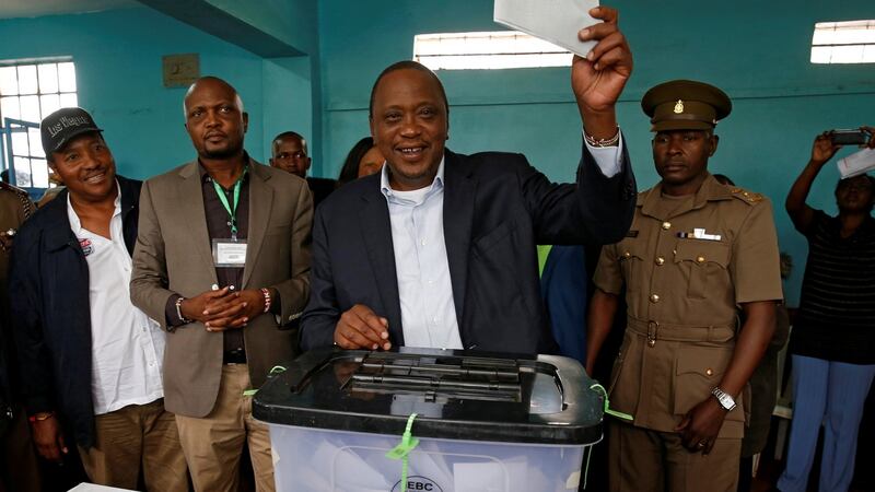 Kenya’s president Uhuru Kenyatta casts his vote during the presidential election re-run in Gatundu. Photograph: Siegfried Modola/Reuters