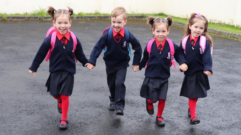 Five-year-old Limerick quads Amelia, Lucas, Mollie and Lily Slattery head off for their first day at Caherline National School. Photograph: Press 22