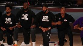 Players, coaches and referees protest racial injustice as NBA returns