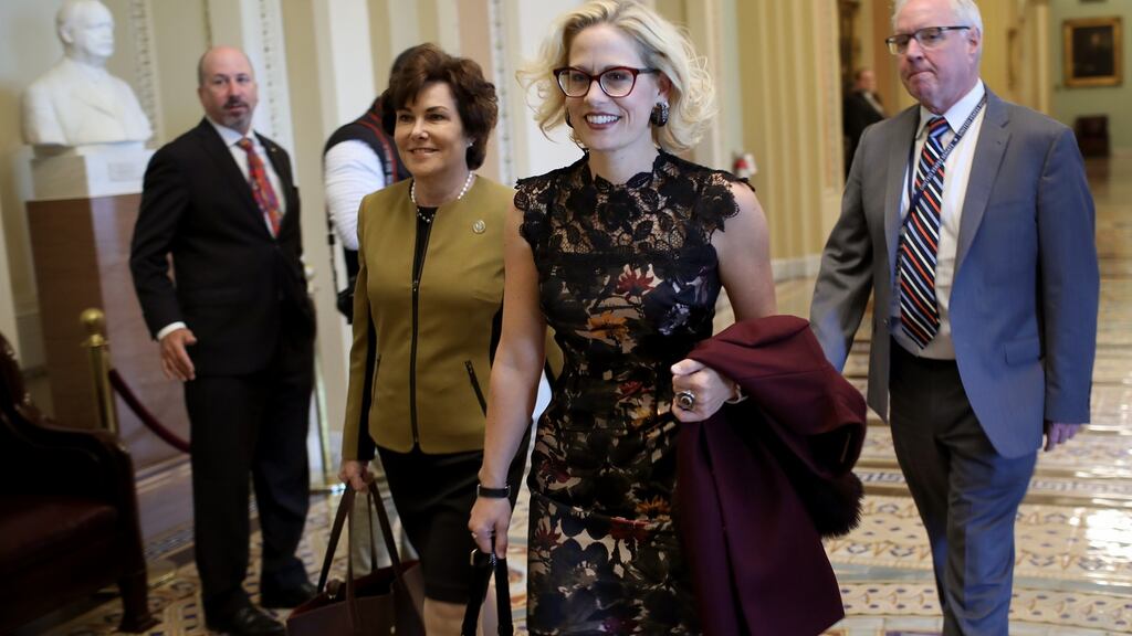 Democratic senators-elect Kyrsten Sinema  and Jacky Rosen  walk to the office of Senate minority leader Chuck Schumer for a meeting at the US Capitol on Tuesday.   Photograph:  Win McNamee/Getty Images