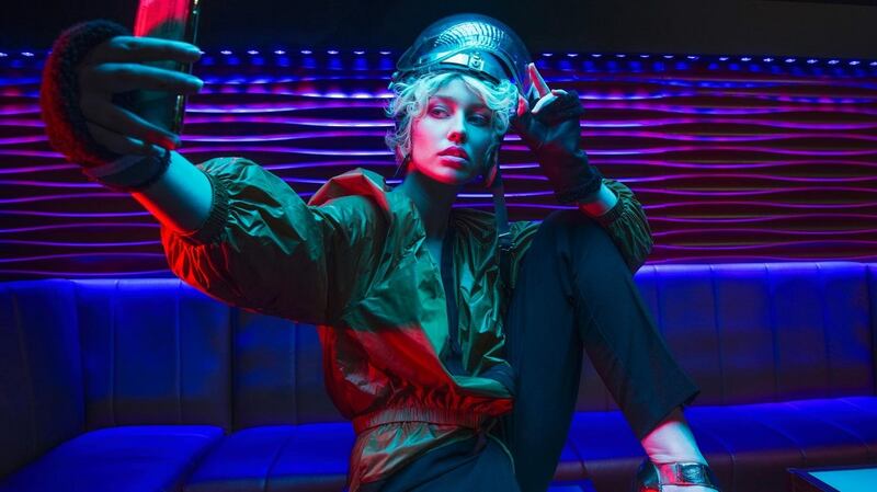 Luxe tracksuit jacket (€240), tracksuit pants (€185), black mittens (€115) all from Olori Boutique, Cork. Bedrock clutch ($208) Kent Stetson Design USA, metallic heels (€127) Shooz Footwear & Accessories, Mallow Cork, vintage Perspex visor helmet (€120) The Village Hall, Cork