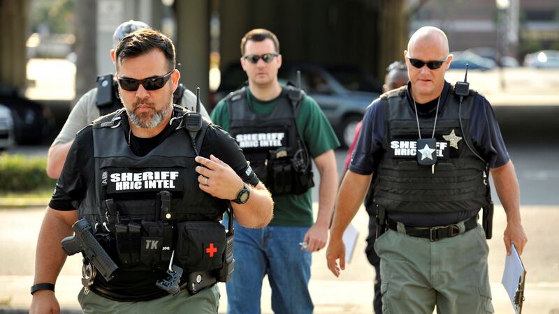 Officers arrive at the Orlando Police Headquarters during the investigation of a shooting at the Pulse nightclub. Photograph: Steve Nesius/Reuters.