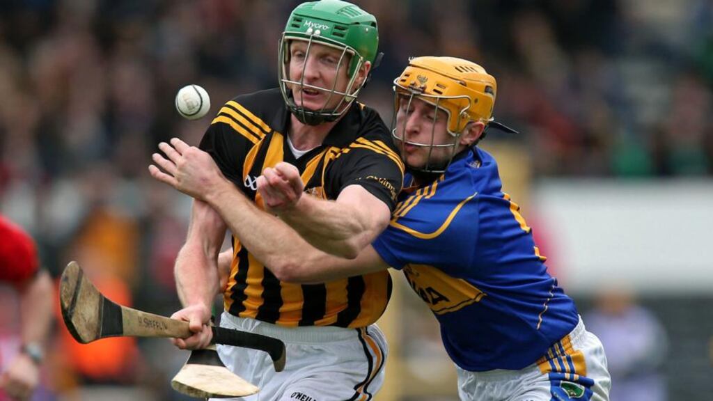 Kilkenny’s Henry Shefflin battles with Shane McGrath of Tipperary during the league clash at Nowlan Park. Photo: Ryan Byrne/Inpho