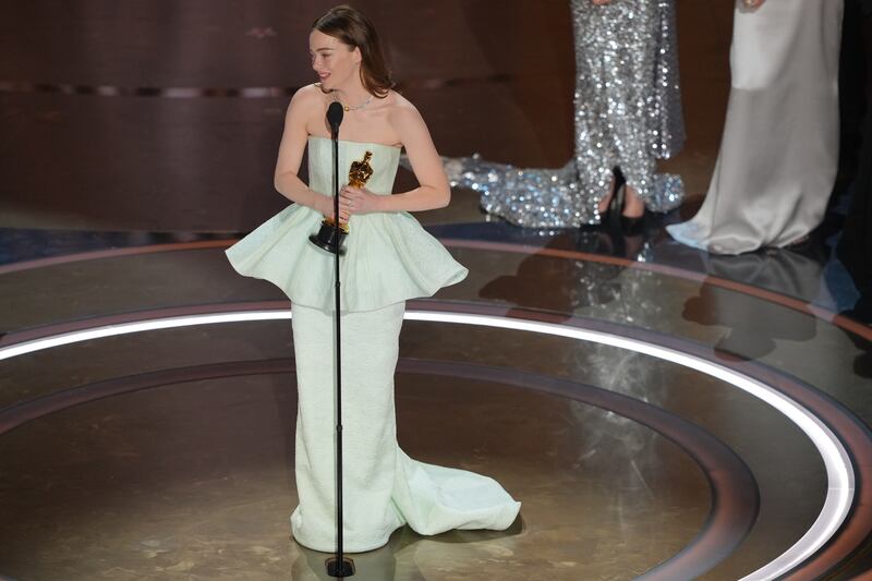 Emma Stone accepts the award for best actress in a leading role for Poor Things. Photograph: Amir Hamja/The New York Times
