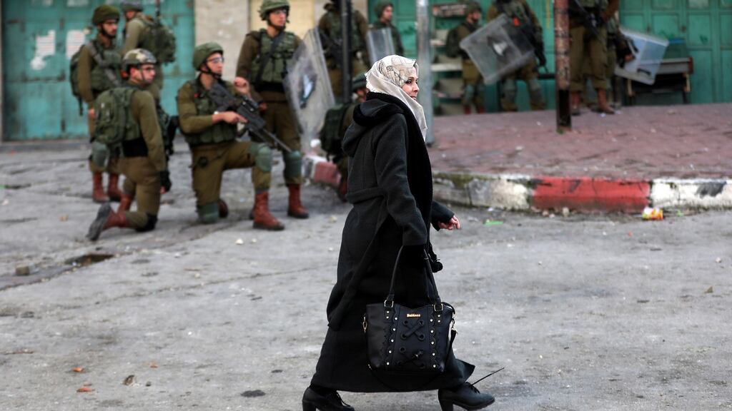 Israeli soldiers take position during a protest against the US “Deal of the Century” to tackle the conflict between Palestinians and Israel, near the West Bank City of Hebron. Photograph: Abed al Hashlamoun