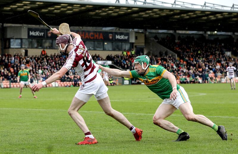 Dunloy’s Kevin Molloy and Peter McCullagh of Slaughtneil vie for the sliotar. Photograph: Declan Roughan/Inpho