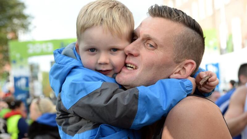 Sean McFadden from Letterkenny welcomed over the finish line by his son David  at last year’s Dublin Marathon. Photograph: Eric Luke / The Irish Times