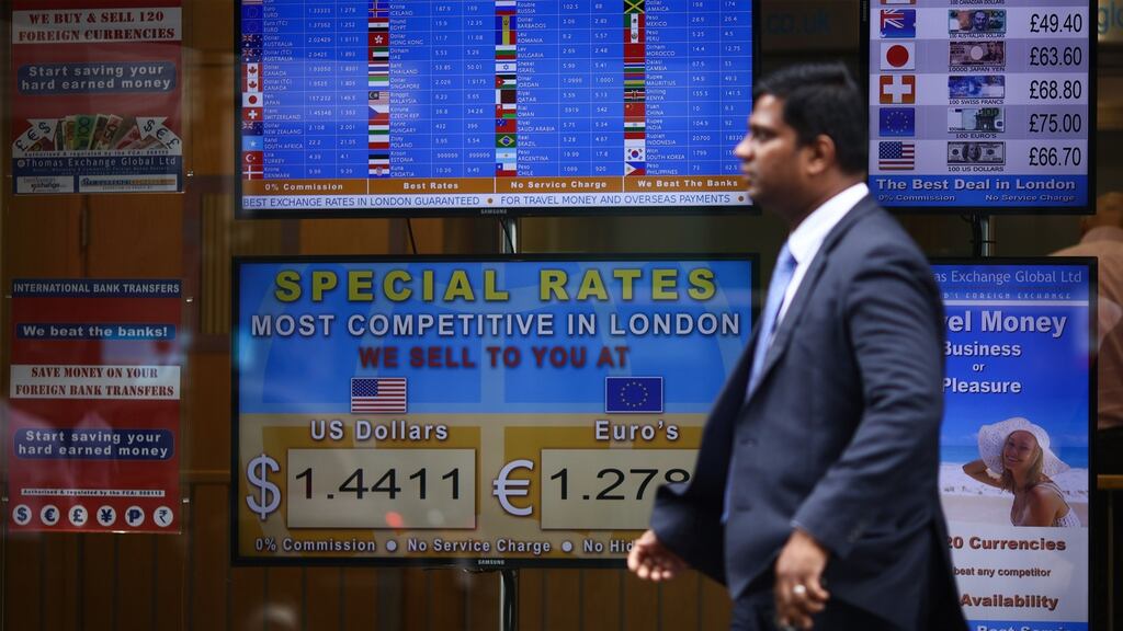 Screens at a foreign currency bureau in London on Wednesday. The pound climbed as traders took cues from betting odds that point to the UK voting to stay in the EU. Photograph: Simon Dawson/Bloomberg