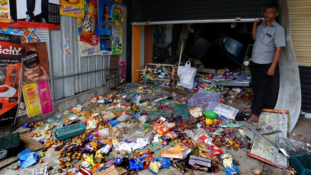 A Sri Lankan Muslim from among the Moor community standing at his business establishment in Pallekelle, Kandy, on Wednesday, after it had been attacked and looted. Photograph: MA Pushpa Kumara/EPA