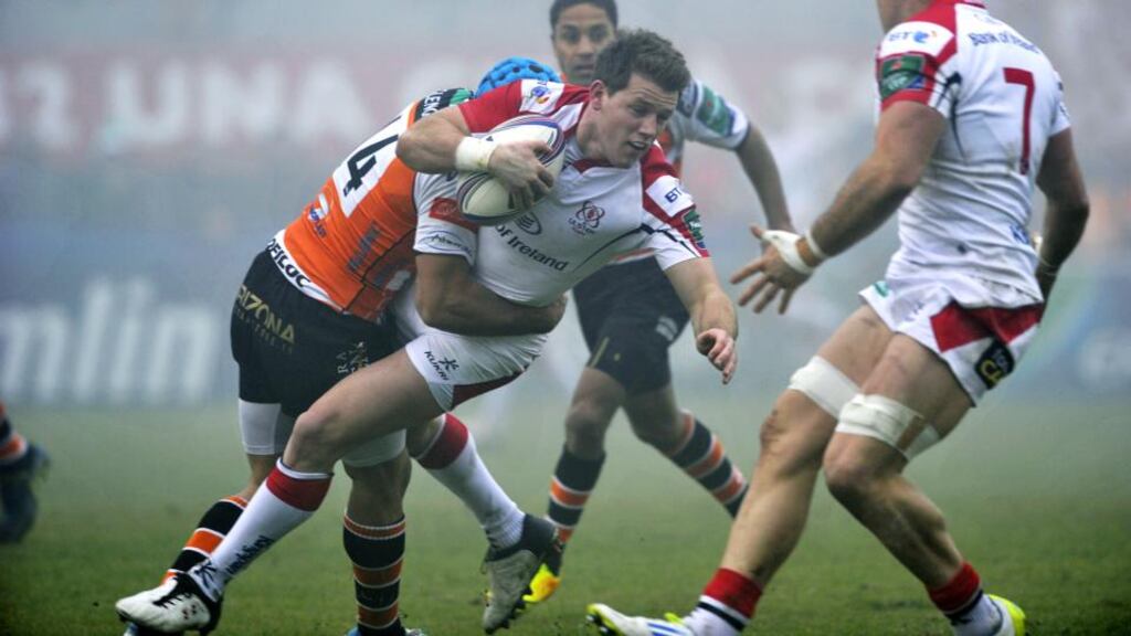 Craig Gilroy of Ulster is tackled by Benetton Treviso’s Edoardo Gori. Photograph: Elena Barbini/Presseye/Inpho