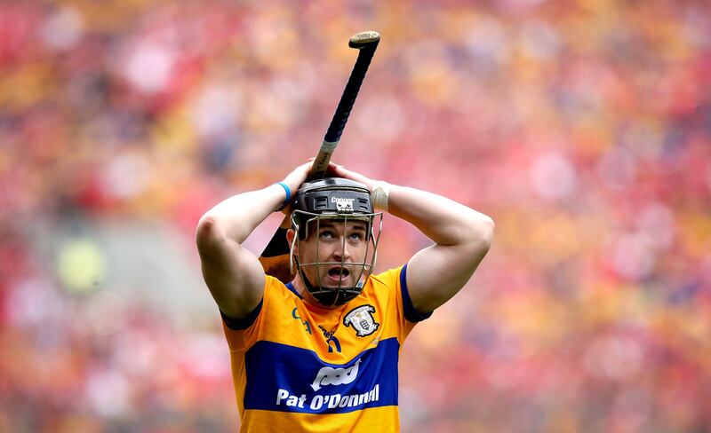 Clare’s star Tony Kelly checks the score late in the All-Ireland final against Cork at Croke Park. Photograph: Ryan Byrne/Inpho