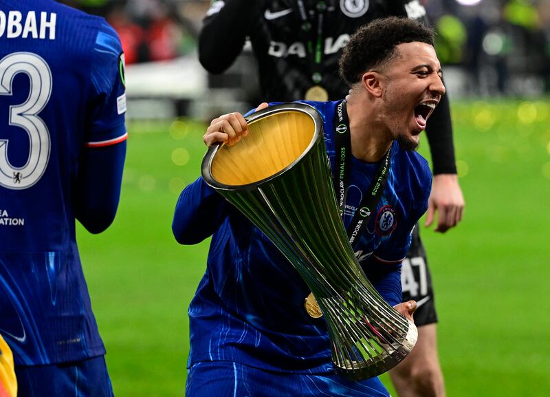Chelsea's Jadon Sancho celebrates with the trophy after the Conference League final. Photograph: John MacDougall/Getty
