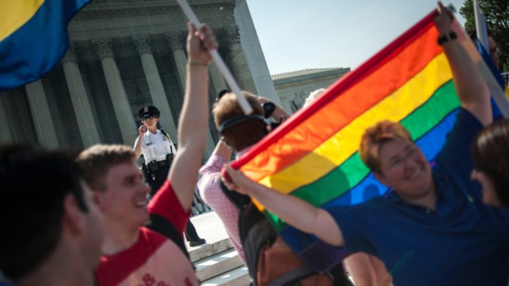 Supporters of same-sex marriage outside the US Supreme Court in Washington yesterday. The court handed a significant victory to gay rights advocates by recognising that married gay men and women are eligible for federal benefits, paving the way for same-sex marriage in California. Photograph: James Lawler Duggan/Reuters