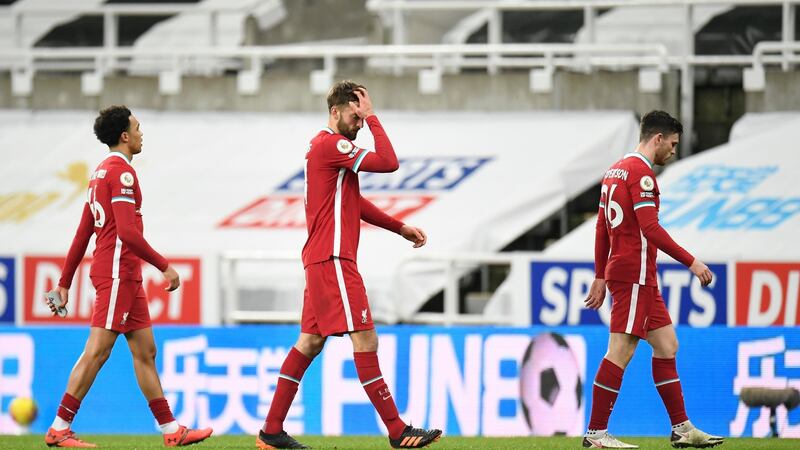 Liverpool’s Trent Alexander-Arnold, Nathaniel Phillips and Andrew Robertson react after their draw with Newcastle. Photograph: Peter Powell/EPA