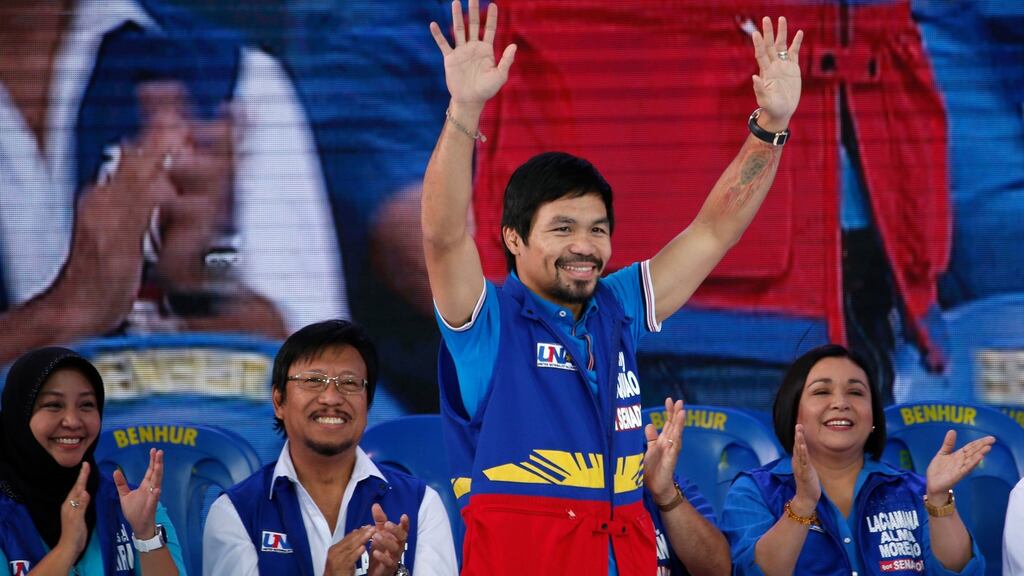 Manny Pacquiao, who is running for senator, on the campaign trail in the Philippines. Photograph: Reuters